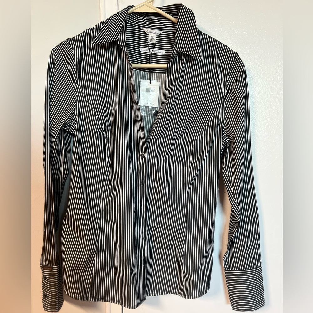 Brand new Calvin Klein Shirt. This is a woman shirt brand new with tag.